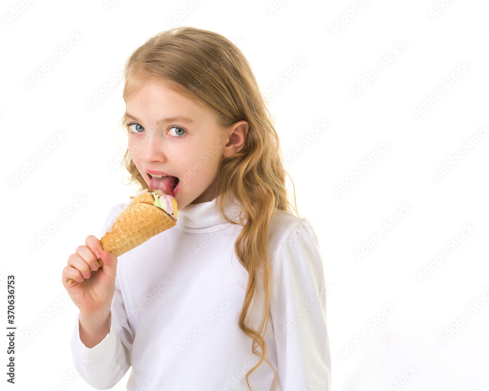 Little girl gently licks a very cold ice cream. Little girl gently licks a very cold ice cream.