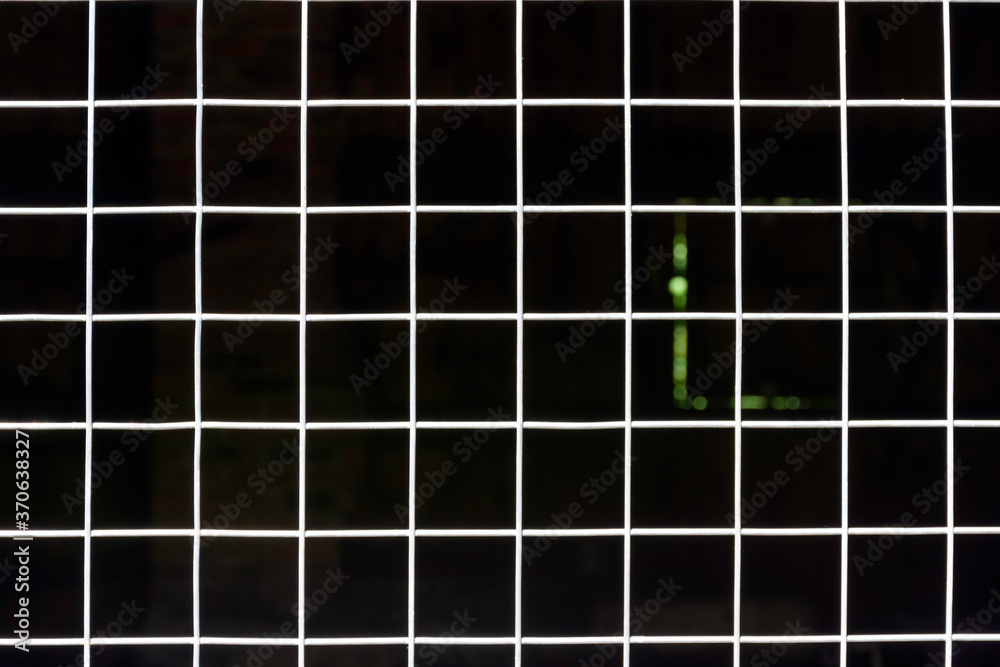 Abstract geometric background with metal fence. Concept of a light at the end of the tunnel. Abstract geometric background with metal fence. Concept of a light at the end of the tunnel.