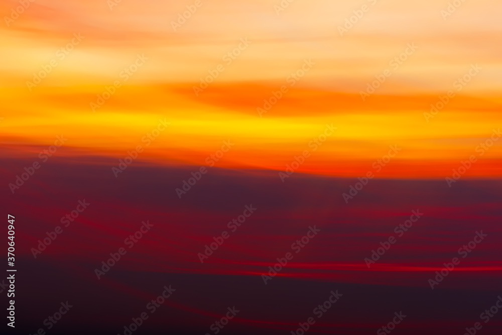 Abstract and colorful blurry sky background with sunset sunset light