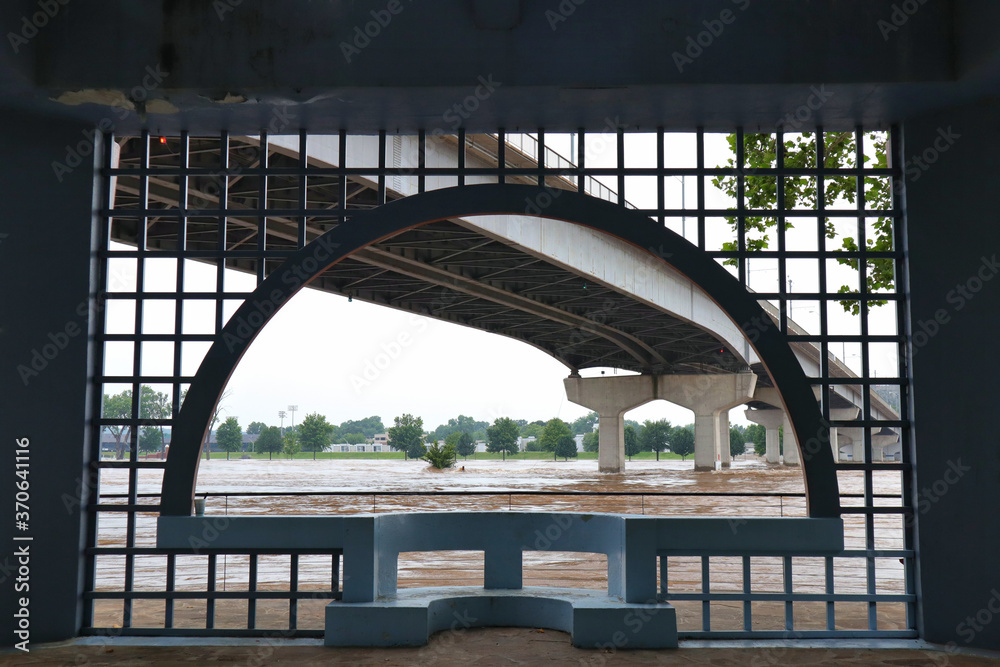 Fototapeta premium Arch frame around flooded river and bridge
