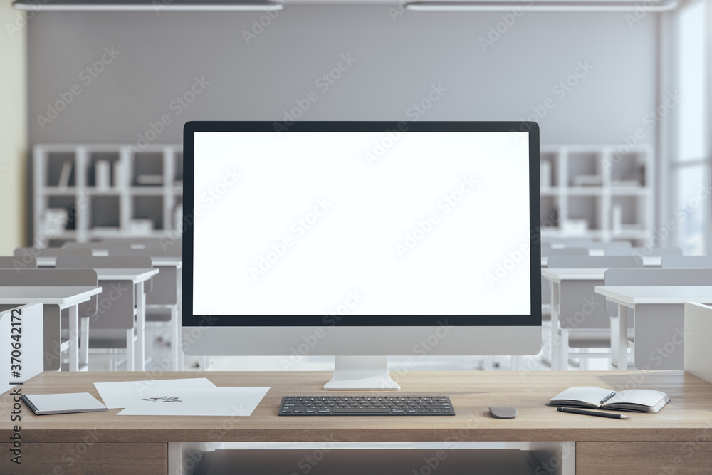 Empty white computer screen on table Empty white computer screen on table