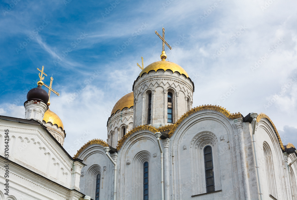Assumption cathedral in Vladimir. Ancient russian orthodox church from white limestone with golden domes.