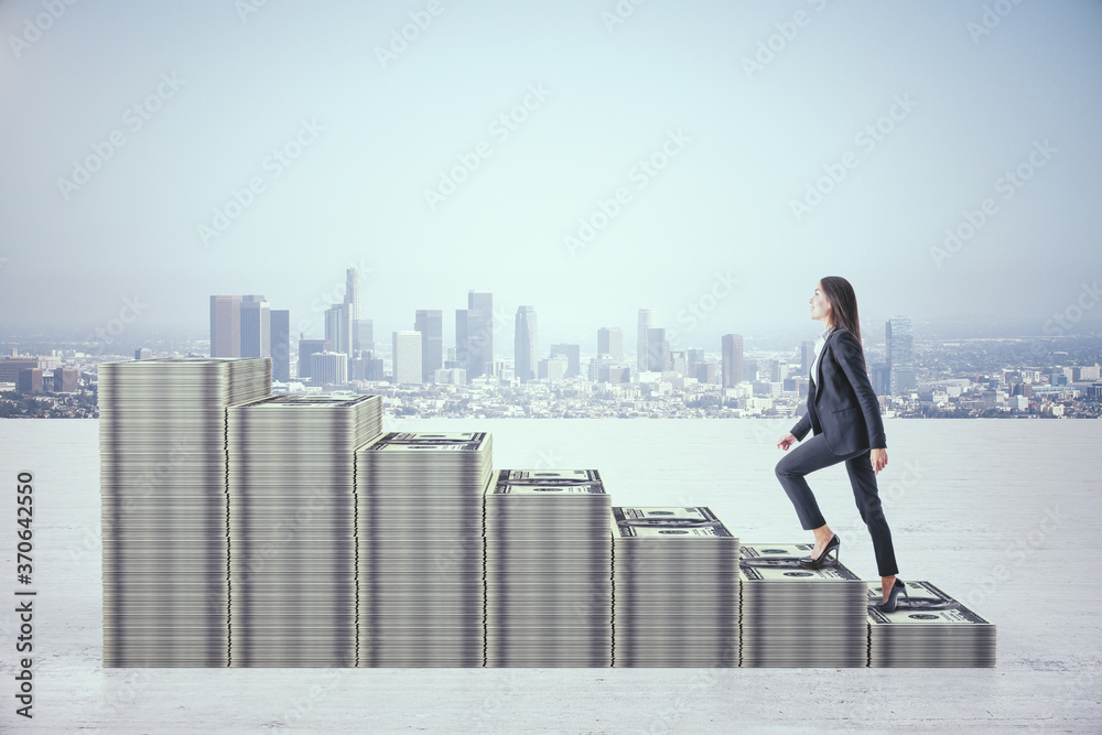 Businesswoman rises in stacks of dollars money in form chart on city background.