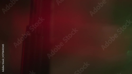 Close up of green spotlight beam flaring