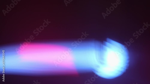 Close up of blue spotlight beam flaring