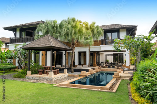 Exterior design of house, home and pool villa feature swimming pool, terrace, landscape garden and sun bed