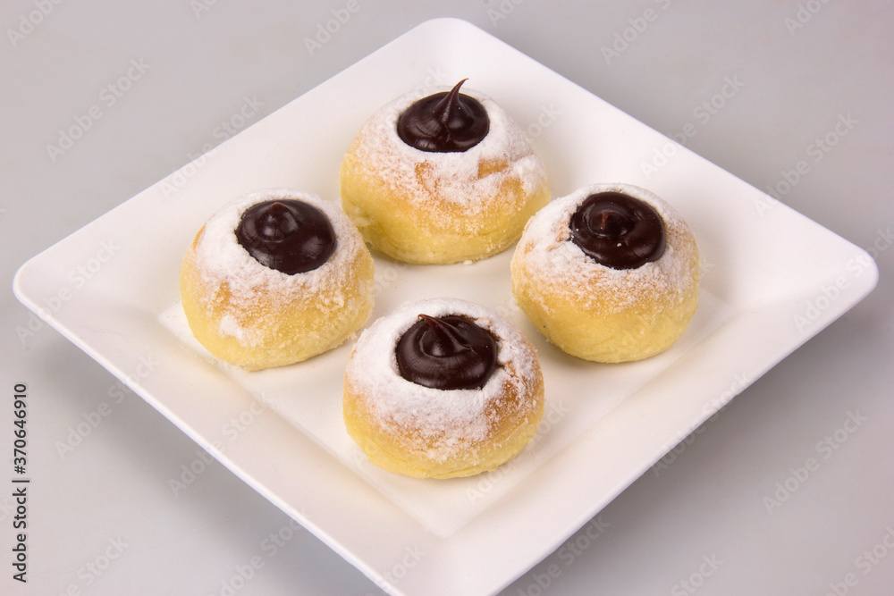 Sweet bread stuffed with dulce de leche (doce de leite). Traditional Brazilian sweet. Sweet bread stuffed with dulce de leche (doce de leite). Traditional Brazilian sweet.
