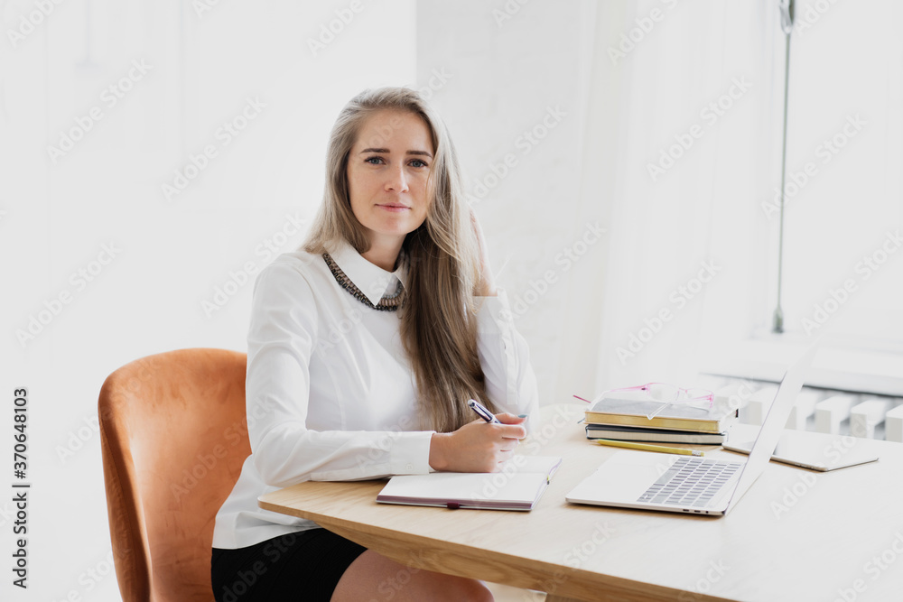 young businesswoman working on her laptop young businesswoman working on her laptop