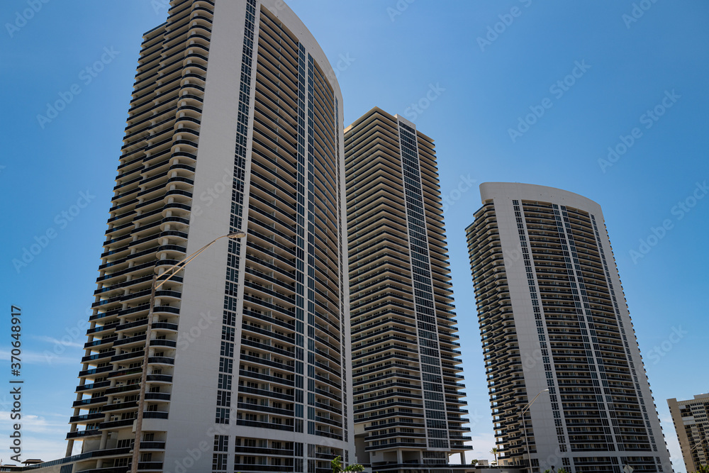 Miami, USA - MAY, 2020: Apartments in skyscrapers. Tall houses, real estate. Expensive US real estate. Investments.