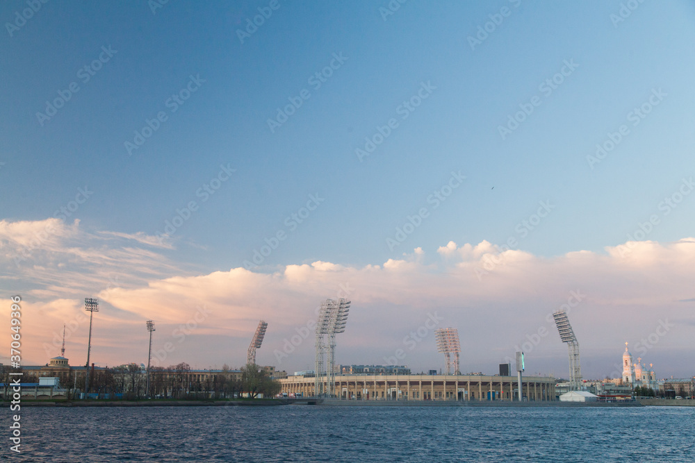 Fototapeta premium the ship sails along the river during sunset