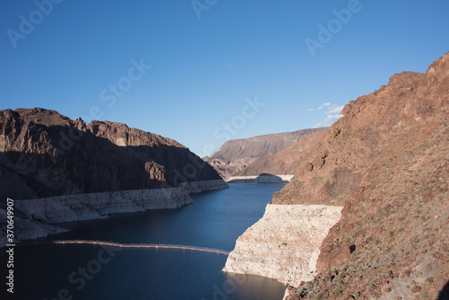 Lake Mead NRA, Arizona - March 2019: View of Colorado River from Arizona side facing northeast with white mineral leaching from low water conditions.