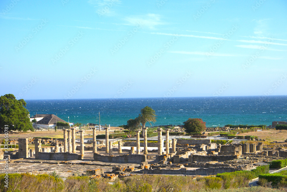 Scenic landscape with ruins of Baelo Claudia is an ancient Roman town on the coast of Spain, Roman city forum, Bolonia, Andalusia, Spain.