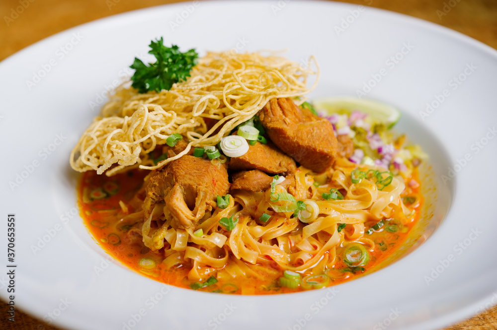 thai style chicken or duck red coconut curry noodle soup with crispy noodle Khao Soi thai style chicken or duck red coconut curry noodle soup with crispy noodle Khao Soi