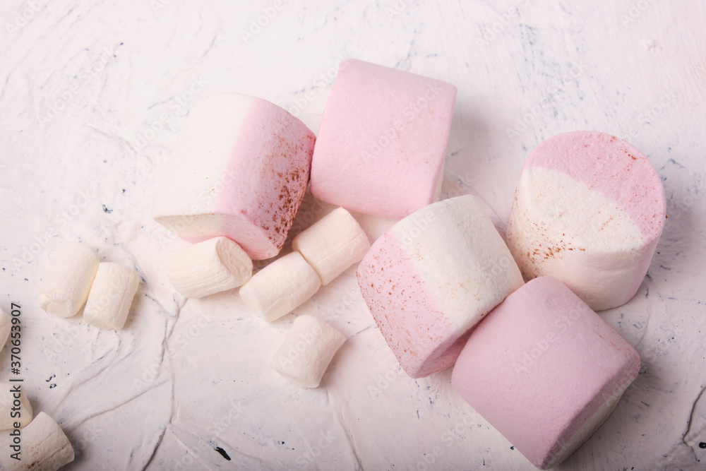 a bunch of marshmallows on a white background, soft candies with natural juice a bunch of marshmallows on a white background, soft candies with natural juice