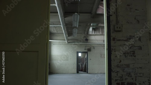 Wall and metal door in vacant and abanonded industrial loft warehouse. Background texture, loft, studio, 4K photo