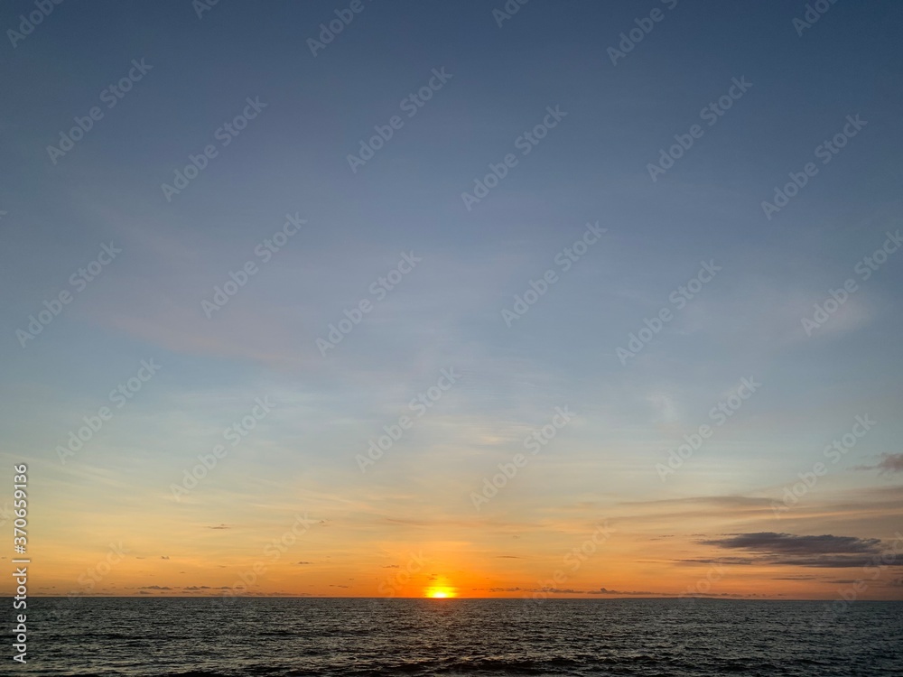 Landscape view of vibrant sunset over calm seascape