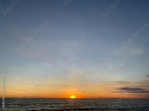 Landscape view of vibrant sunset over calm seascape