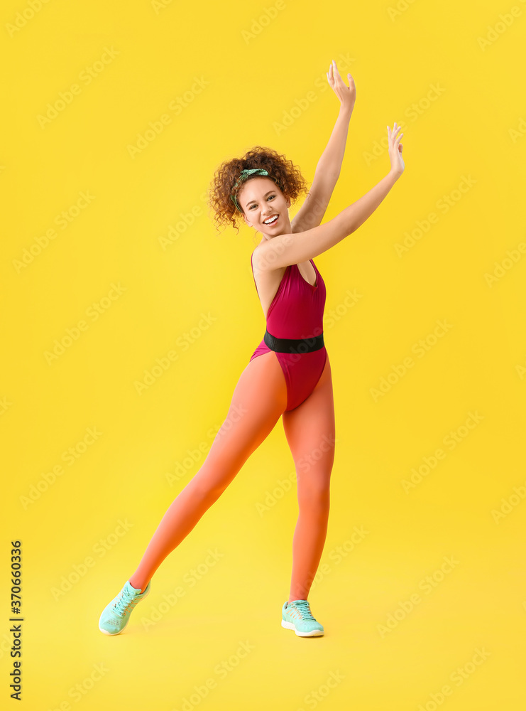 Young woman doing aerobics on color background Young woman doing aerobics on color background