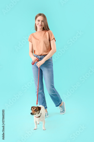 Young woman with cute dog o...