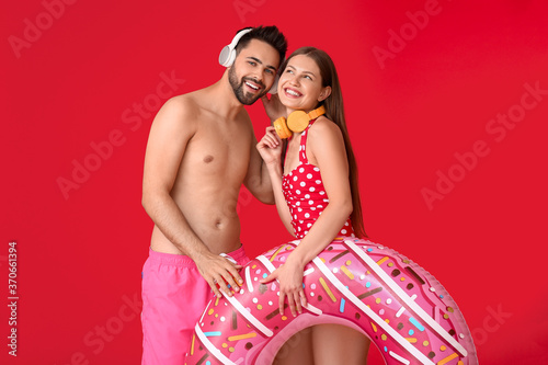 Young couple with headphone...