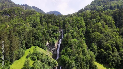 Aerial cinematic shot of Diesbachfall in Glarus, Switzerland photo