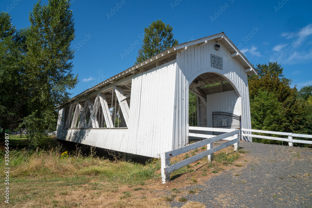 The Weddle Bridge, a white covered bridge near Sweet Home, Oregon, spans Ames Creek The Weddle Bridge, a white covered bridge near Sweet Home, Oregon, spans Ames Creek