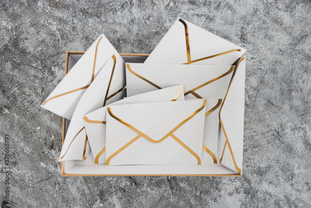 concept of inbox organisation, group of envelopes inside box metaphor ...