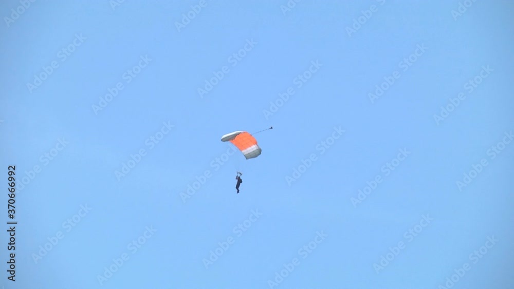 Training parachute jumps. Parachutist who jumped from a sports plane