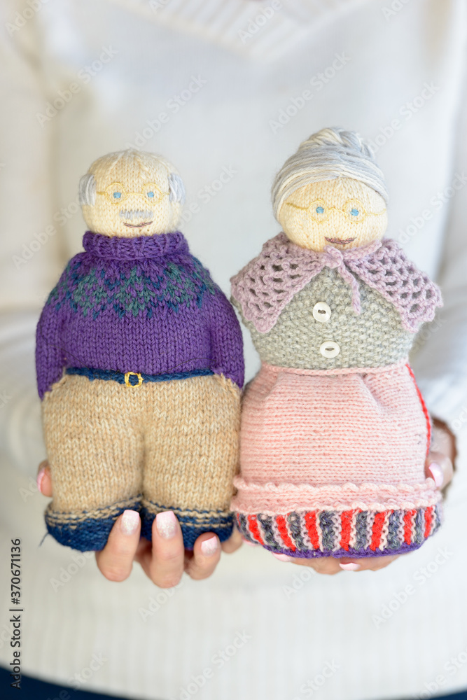 Portrait of knitted and handmade stuffed dolls