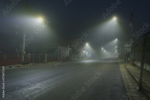 Light and fog in the morning, dangerous lonely road