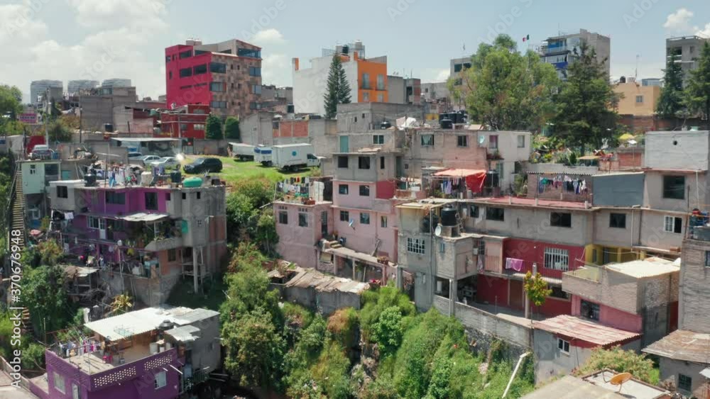 Popular tourist attraction in Mexico city, Latin America. Closeup of vibrant favelas in latino country suburban district. Traveling Central America. Colorful buildings in low-income district 4K aerial Popular tourist attraction in Mexico city, Latin America. Closeup of vibrant favelas in latino country suburban district. Traveling Central America. Colorful buildings in low-income district 4K aerial