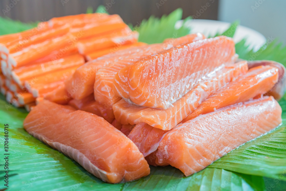 Salmon slices fresh uncooked red fish fillet for sushi and steak Salmon slices fresh uncooked red fish fillet for sushi and steak