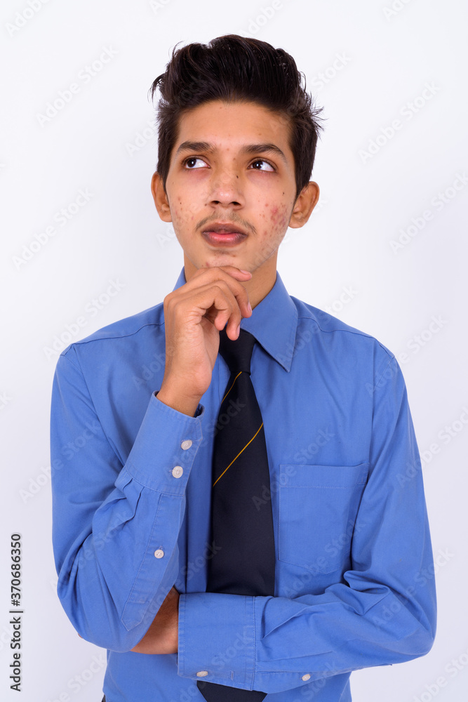 Portrait of young handsome Indian teenage boy as businessman Portrait of young handsome Indian teenage boy as businessman