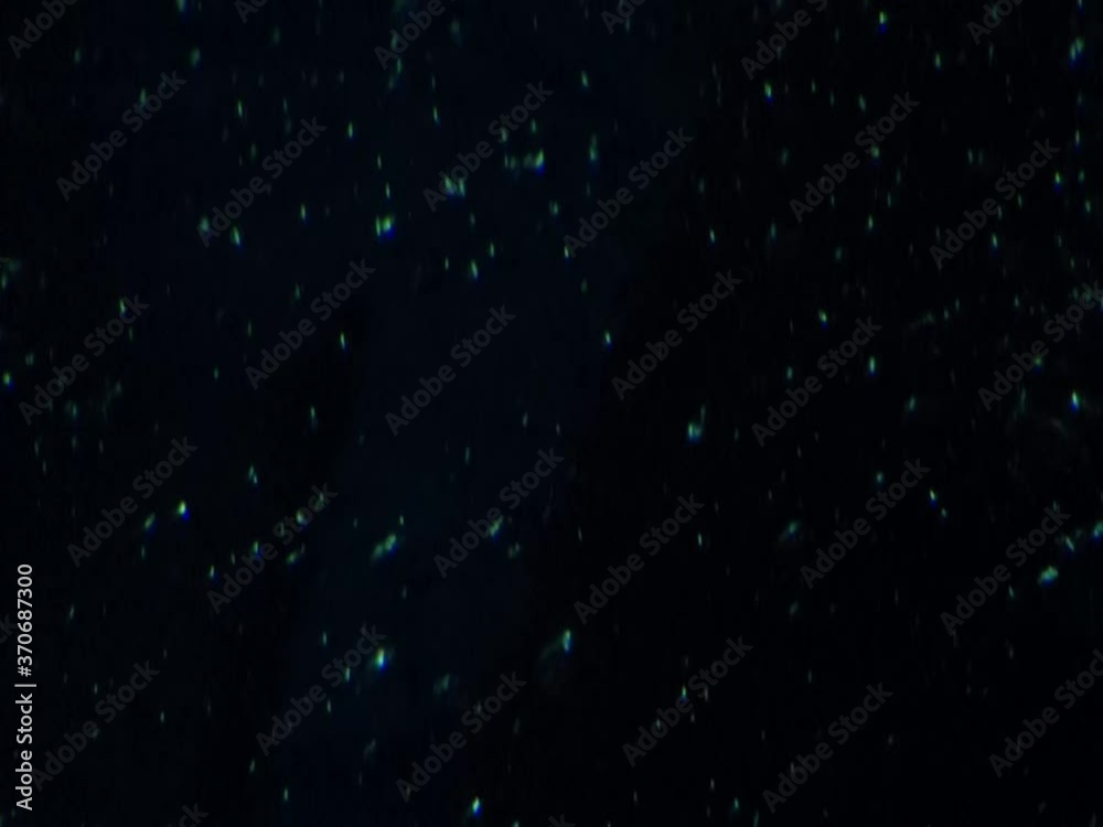 Mystische blaue Blubberblasen steigen nach oben auf. Der Hintergrund ist matt dunkel blau, die Blasen sind etwas heller und glänzend. Dunkles Aquarium Sea-life Oberhausen. Abstract spooky background.