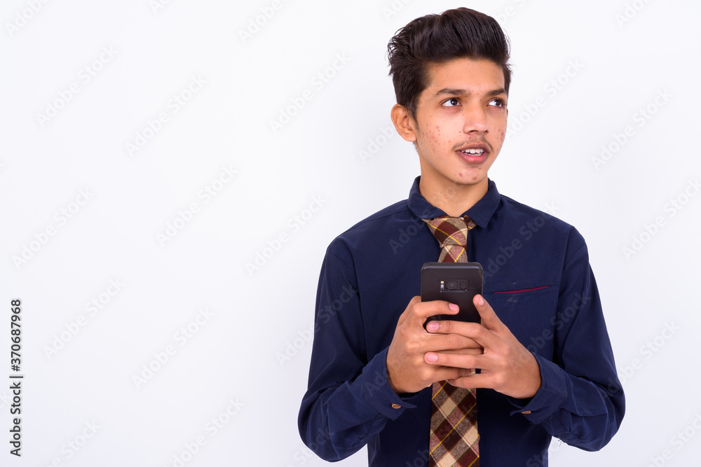 Portrait of young handsome Indian teenage boy as businessman Portrait of young handsome Indian teenage boy as businessman