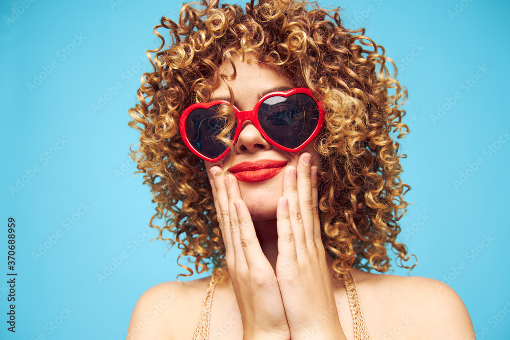 Emotional blonde party on an isolated blue background Emotional blonde party on an isolated blue background