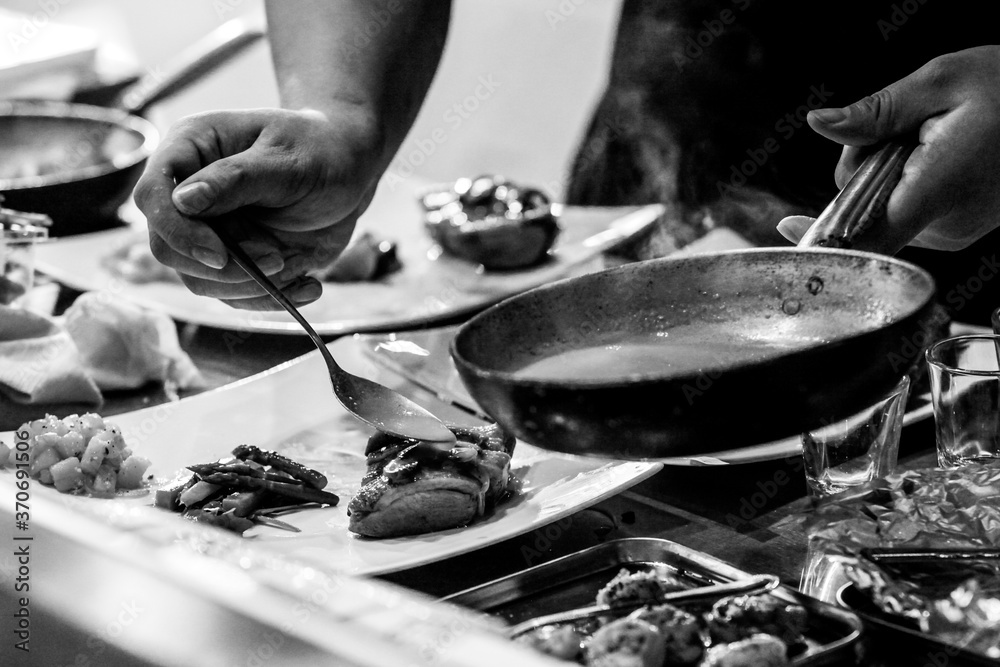Fototapeta premium Chef cooking, Chef preparing food in the kitchen