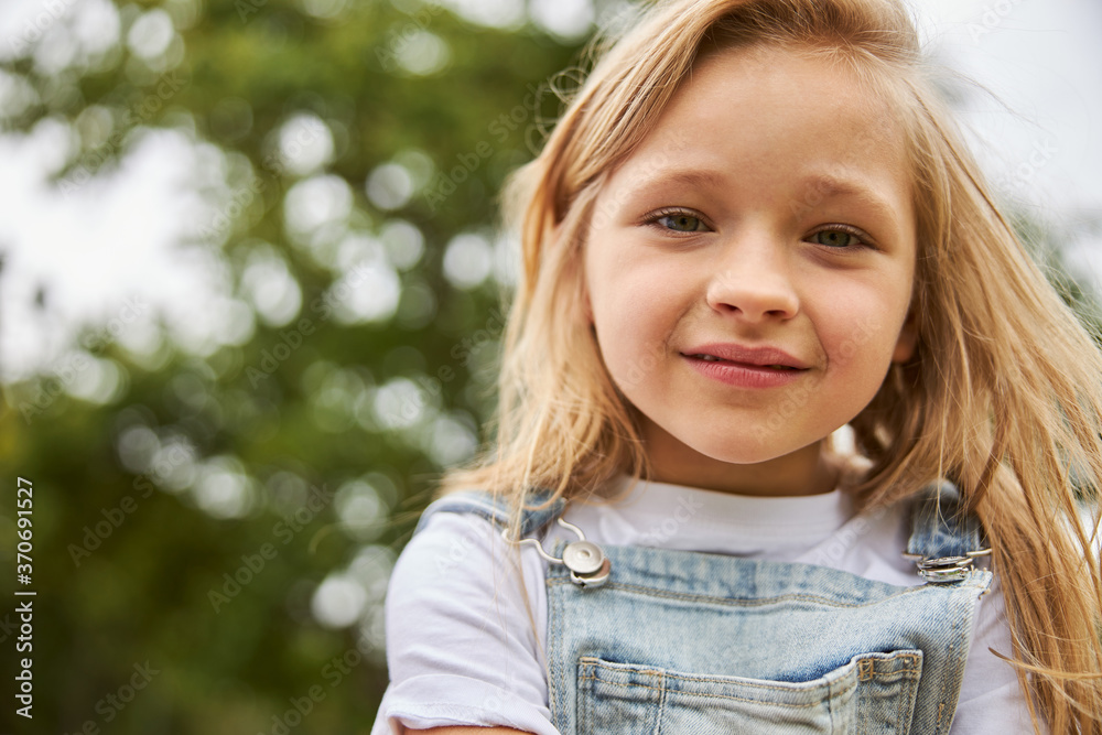 Cute child enjoying good warm weather in the park Cute child enjoying good warm weather in the park