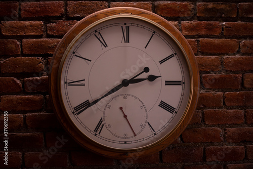 Wallpaper Mural Round wall mounted clock with roman numerals. Torontodigital.ca