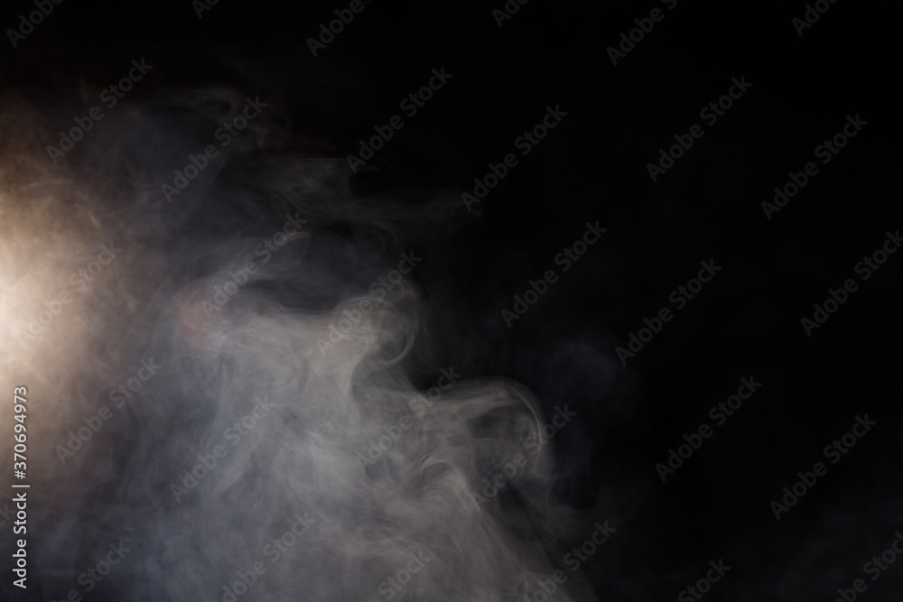 Dense Fluffy Puffs of White Smoke and Fog on Black Background Dense Fluffy Puffs of White Smoke and Fog on Black Background