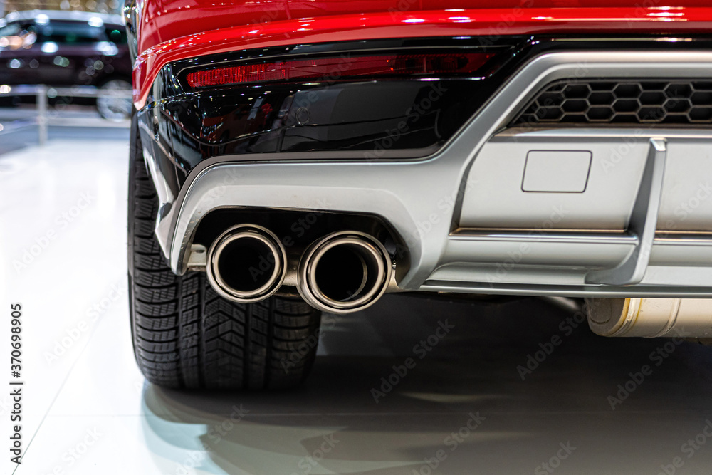 Expensive luxury sports SUV with dual exhaust. Exterior detail close-up.