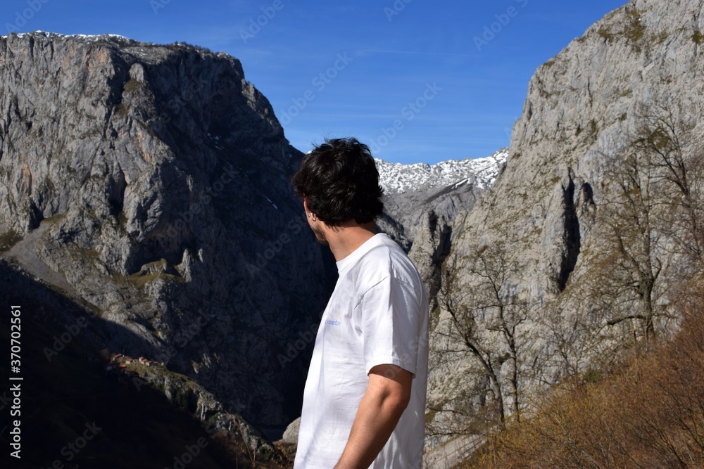 Boy looking at the mountains