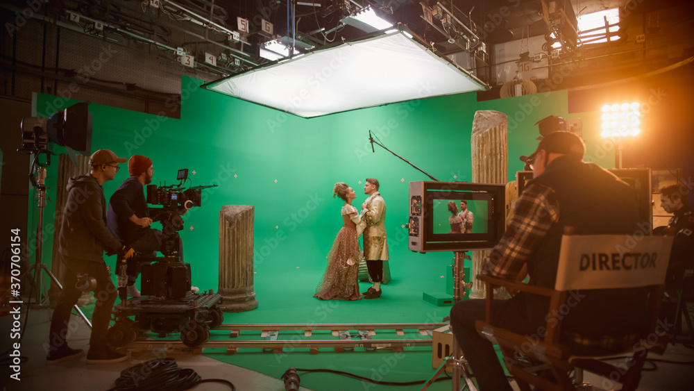 Film Studio Set: Shooting Green Screen Scene with Two Talented Actors Wearing Renaissance Clothes Talking, Embraces. Period Drama Movie Backstage - obrazy, fototapety, plakaty 