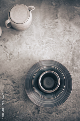 empty dishes on gray concrete background with copy space