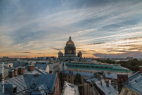 Rooftop cityscape of Saint Petersburg with St Isaac's cathedral in time of sunset © Дэн Едрышов
