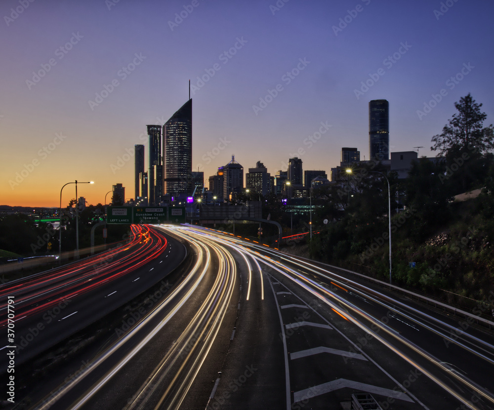 Brisbane City skyline sunset light trails 
