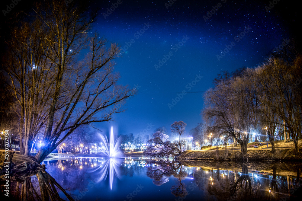 Fountain in the pond in the city at night. Fountain in the pond in the city at night.