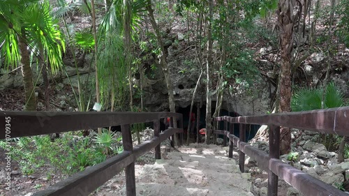 Entrance to the Zacil Ha cenote (Clear Water) in the Kantun-Chi ecopark. Mexico. photo