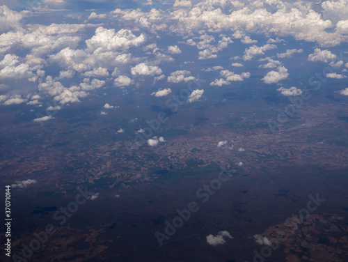 view from the airplane window, above the clouds and sky © fototrips