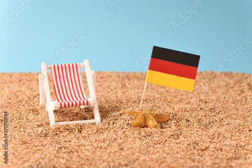 Sunbed on the beach with German flag. Vacation in Germany.
